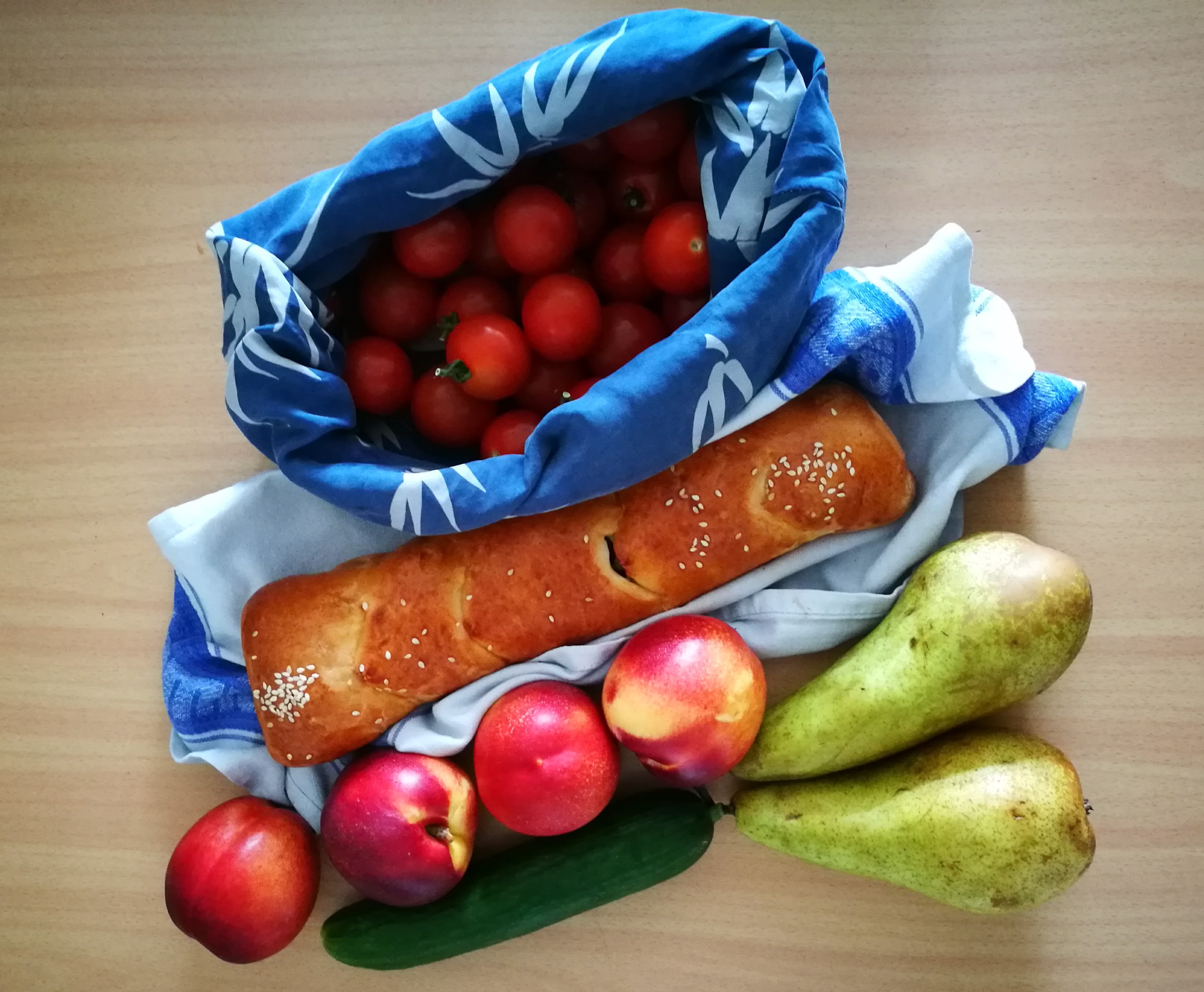 plastic free shopping. bread, tomatoes, fruit.